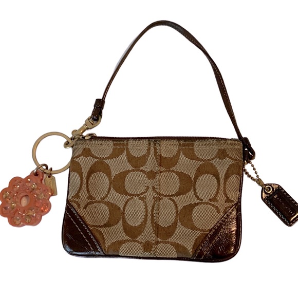 Coach Handbags - Coach Wristlet with “gem” flower keychain/charm